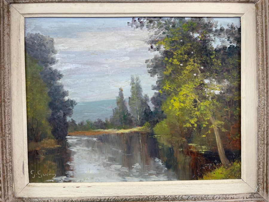 G. GUERIN (XXe). Vue de rivière arborée. Huile sur Isorel. Seconde moitié du XXe siècle. Cadre : 40 x 48 cm.